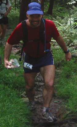 Ed climing hill into 19 mile aid station